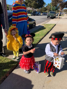 Preschool students dressed in Halloween costumes lining up for a costume parade at preschool daycare.