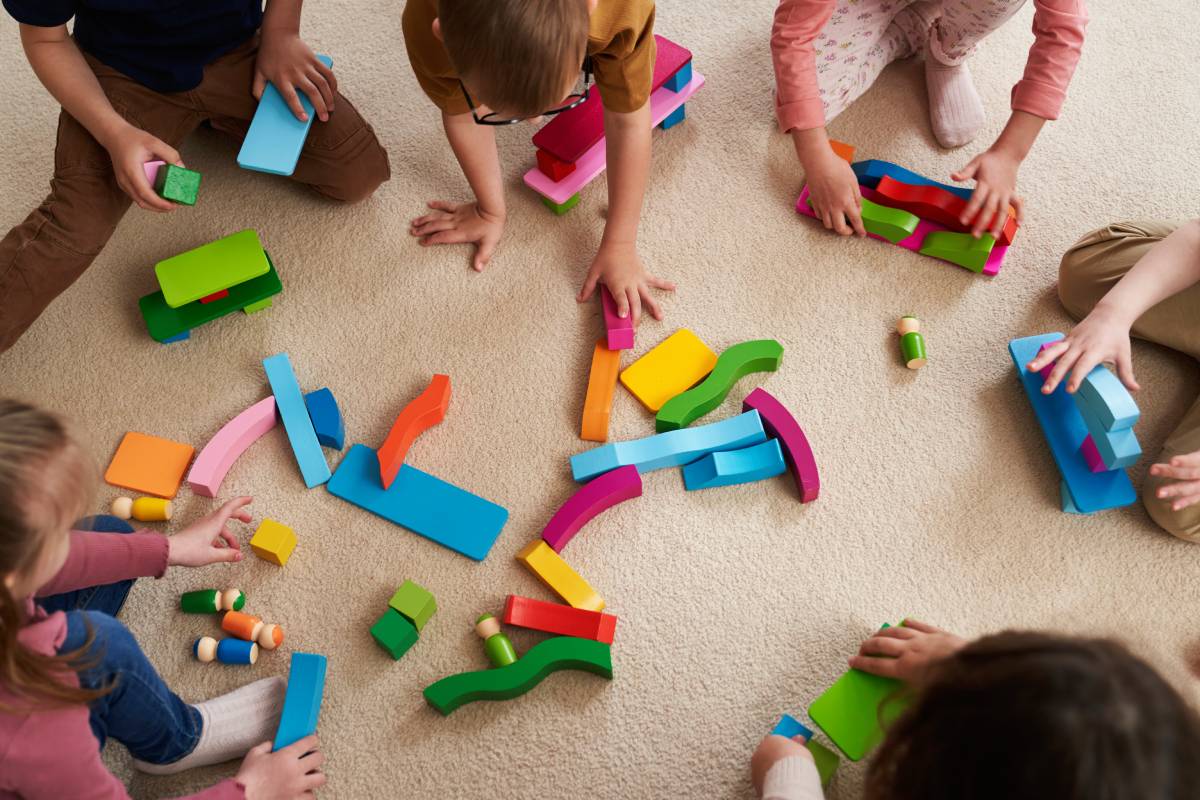 Children playing with colorful blocks.